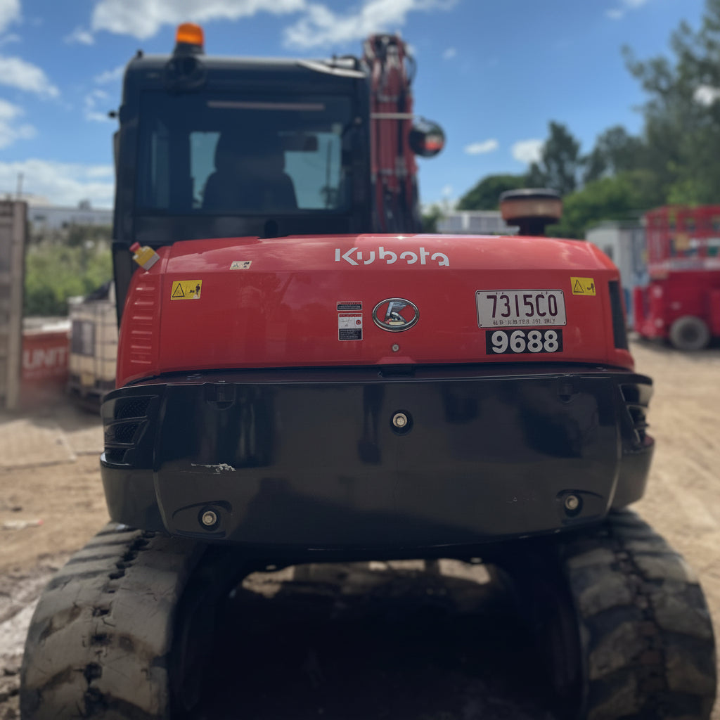 A Kubota KX080-3 excacavator photographed from behind